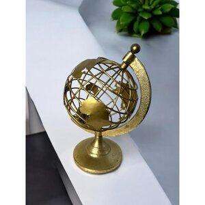Gold Metal Decorative Globe Sculpture With Rotating Axis And Map Cutouts